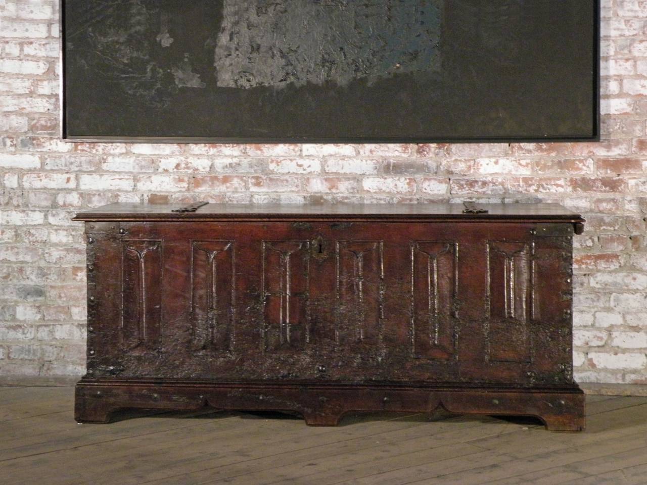 A rare survivor from the late 15th century. The large size, simple linear design with the decorative book fold panels in contrast with the distressed look give it an attractive archaeological appearance. The visible construction showing the massive