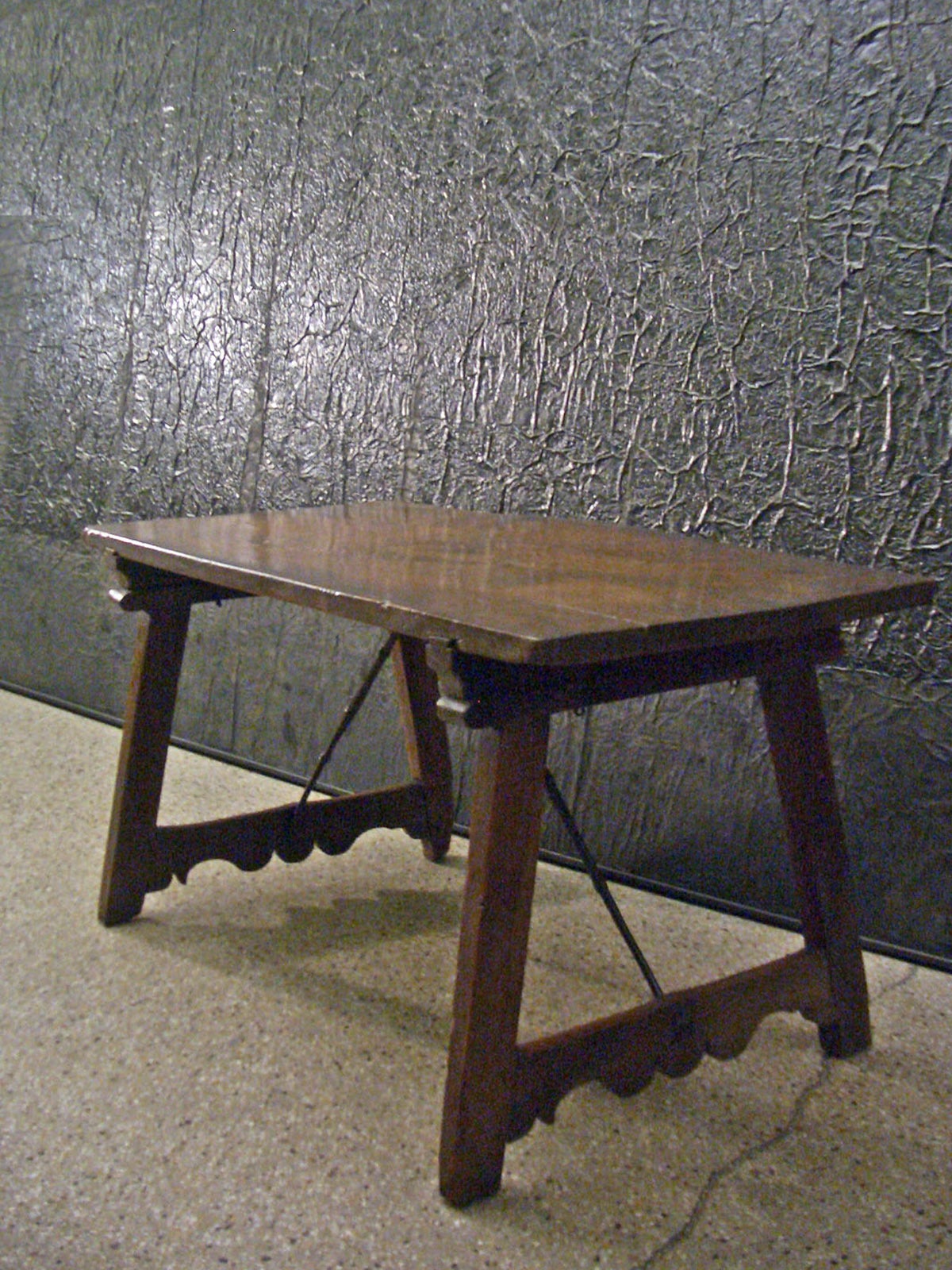 Single-plank top supported by a simple, linear base with wrought iron stretchers.
Deep color and patina.
Our pieces are left in lived-in condition, pending our custom conservation and polish to preference.
On consignment from a sophisticated