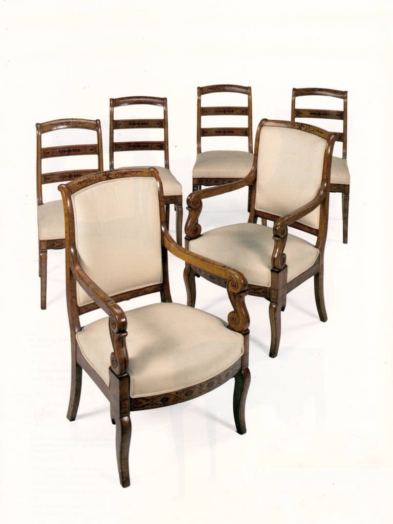 The set consists of two armchairs and four side chairs of good proportion and beautiful, delicate inlay.
The measurements are:
18.5” wide, 22” deep, 35” high (side chairs).
23.5” wide, 24” deep, 37.5” high (side chairs).
