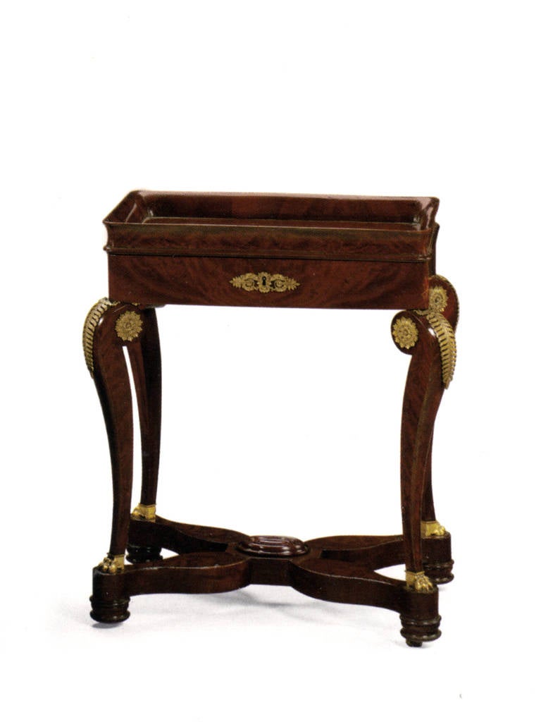 The petite center table or vide-poche with a deep molded rim above a frieze drawer, the cabriole legs adorned with ormolu mounts and paw feet joined by X-stretcher, casters.
Our pieces are left in lived-in condition, pending our custom conservation