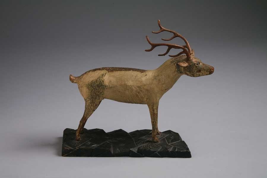 A Carved and Painted Pine Deer<br />
Pennsylvania, USA<br />
<br />
A carved and painted deer with 8-point antlers, on a rock-carved base.<br />
<br />
Carved at a time when hunting was likely more important for survival than simply for sport,
