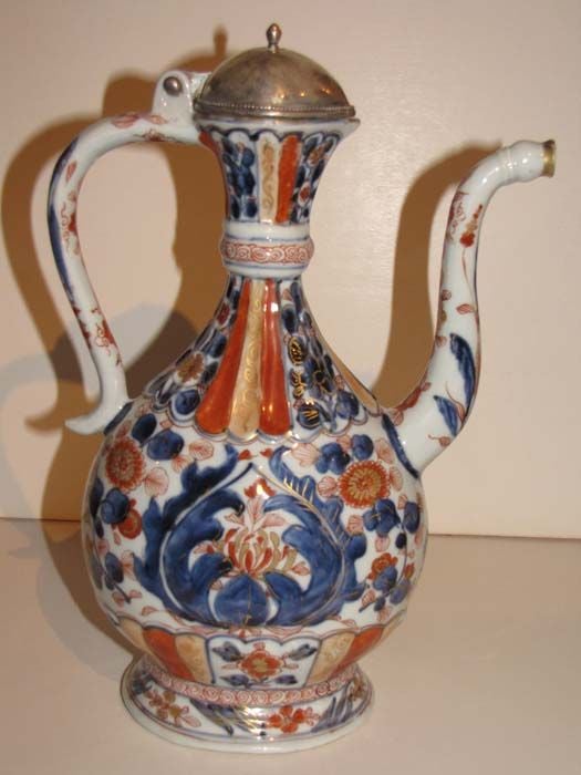 Chinese Imari, Persian-Inspired, Tall Spouted and Handled Ewer, Decorated with Two Rows of Applied Low-Relief Slender Stylized Lotus Leaves at the Neck.  The Canteen-Shaped Body Decorated with an Applied Low-Relief Cartouche Containing a Red and
