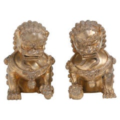 Pair of Chinese  Gilt Bronze Sculptures of Buddhist Lions