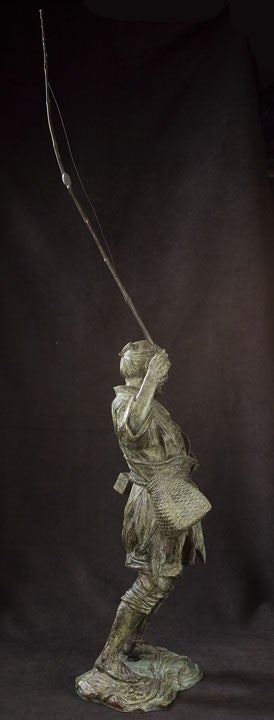 Finely and Realistically Detailed Figure of a Fisherman Landing a Fish, Covered in a Faux Green Patina.