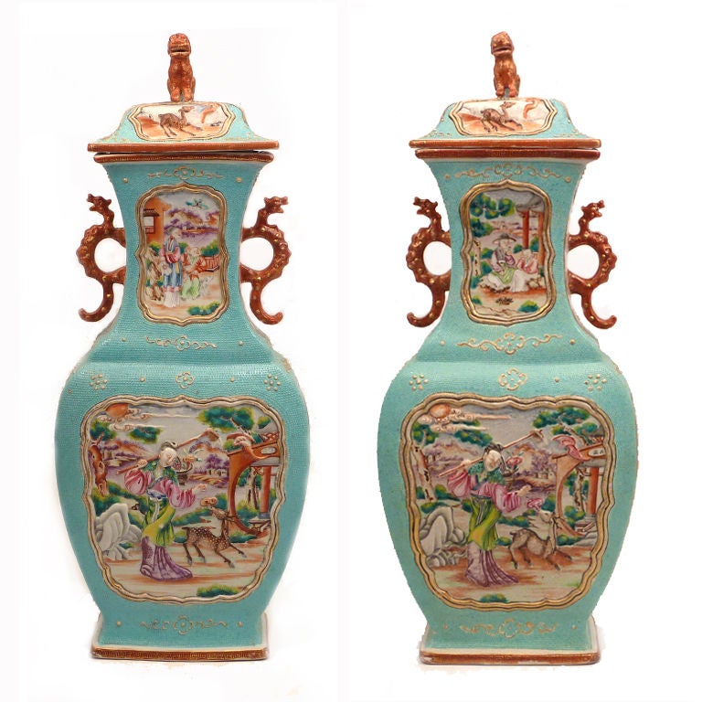 Flattened Quadrangular Shape with Elaborate Rouge de Fer  Dragon Handles.  The Body Decorated with 'Mandarin Palette' Cartouches Depicting Scenes with Chinese Figures in a Garden Setting, All on a Turquoise Glazed 'Chicken Skin' Background