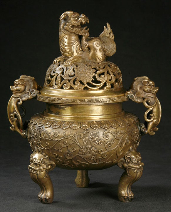 Large Well-Sculpted Bronze Censer, with Fierce Lion Mask Legs, Lotus Blossoms and scrolling vines Encircling the Ample Body, Fully Developed Lions Serving as Handles, and over the Lotus and Vine Reticulated Cover Resides a Magnificent Roaring Lion