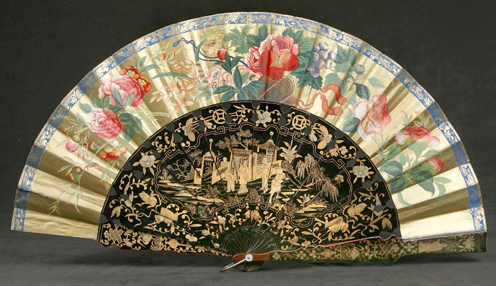 Shows Scenes of Figures in Gardens in Black and Gold Lacquer.<br />
The Rice Paper Fan is Painted with Tree Peonies on One Side and on the Other Side Figures in Houses and Gardens.