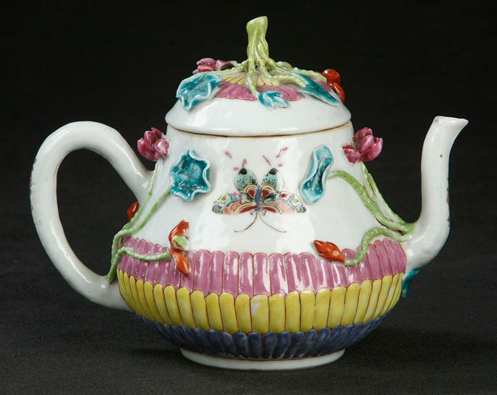 Teapot Decorated in Famille Rose Enamels Showing Three Registers of Bricks Consecutively Colored in Blue, Yellow and Pink Enamels under Two Opposing, Exquisitely Painted Butterflies. Finally, Flower Buds and Vines Cleverly Applied around the Teapot