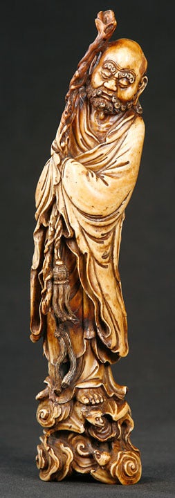 Extremely Well-Carved, Robed Figure Standing on Waves.  The Gnarled, Rootwood Staff, the Braided Belt Tassel, the Roiling Waves and,the Elaborately Folded Robes, and,the Detailed Feet all Attest the Exquisite Craftsmanship of this Figure