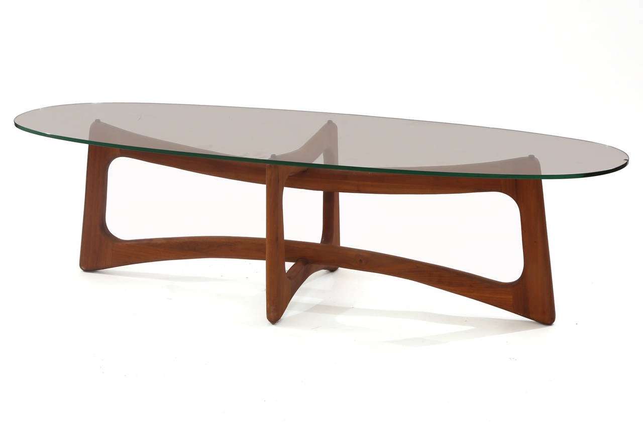Adrian Pearsall solid walnut bowtie cocktail table, circa early 1960s. This all original example has a sculptural ribbon shaped oiled walnut base with oval glass top. Measurements below are for base only. Will comfortably support a 60-65