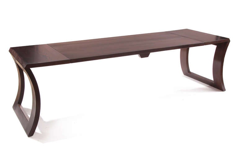 Lacquered oak convertible table by Karpen, circa mid-1950s. This unusual example can be used as a cocktail table or entry/sofa table and has been impeccably refinished in a chocolate lacquer. Height extended 25