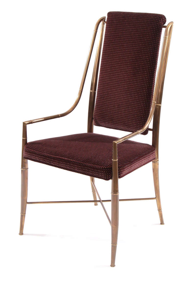 Set of 14 Mastercraft patinated brass dining chairs circa early 1970's. These stunning all original examples have subtly curved brass frames and are upholstered in a supple patterned velvet. This set is comprised of 8 with the fabric shown and the
