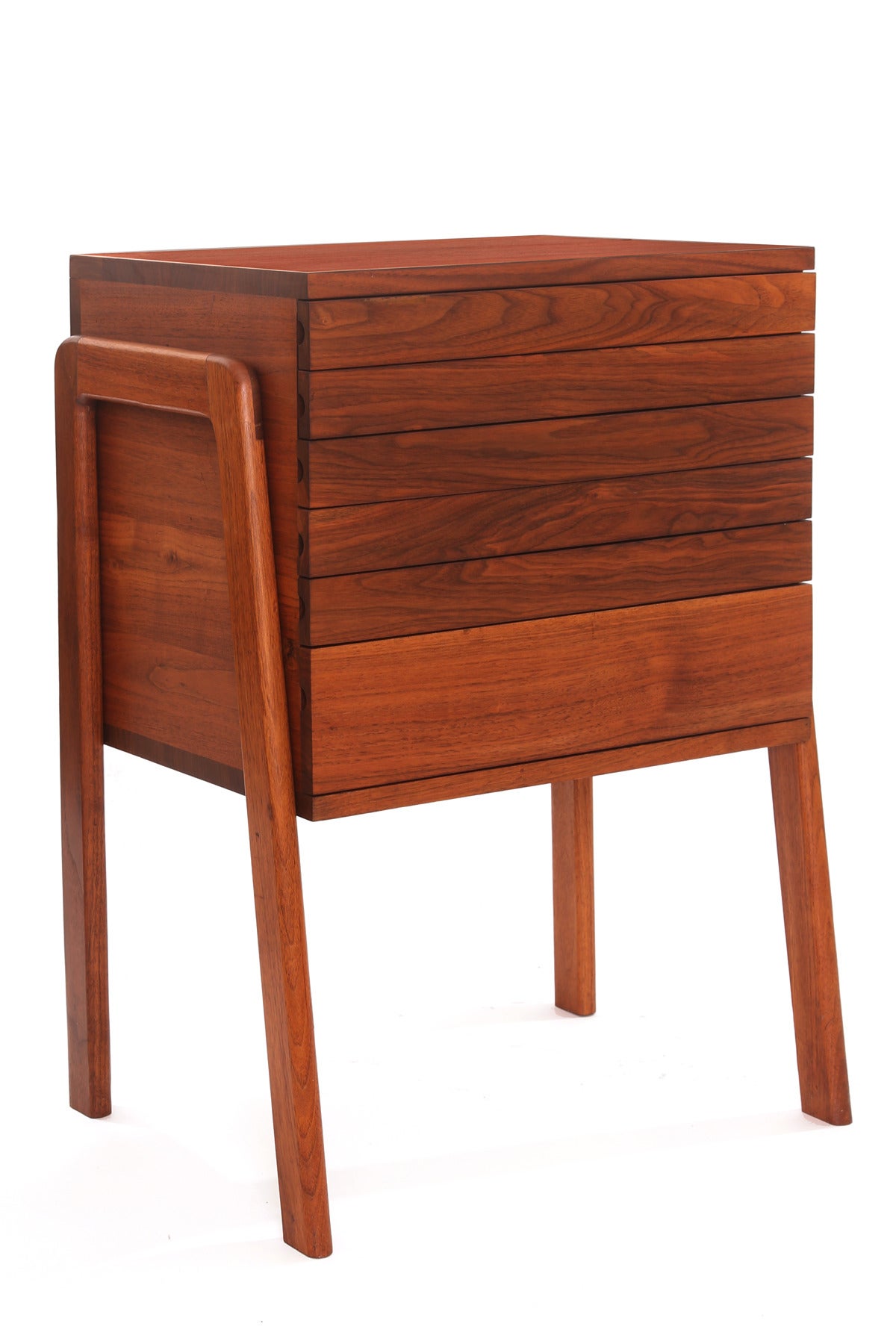 Custom six-drawer walnut jewelry or silverware chest, circa early 1960s. This all original example has six drawers elegant solid walnut side mounted legs and beautifully grained case and drawer fronts.