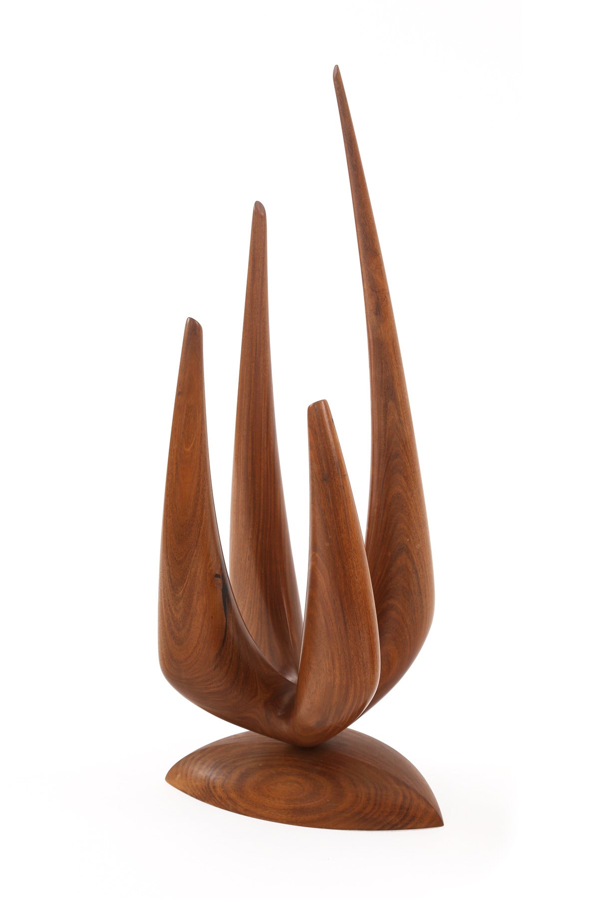 Fabulous pair of tapered walnut sculptures by Criss, circa mid-1960s. These examples are solid walnut and are sold as a pair. The smaller example measures: 16