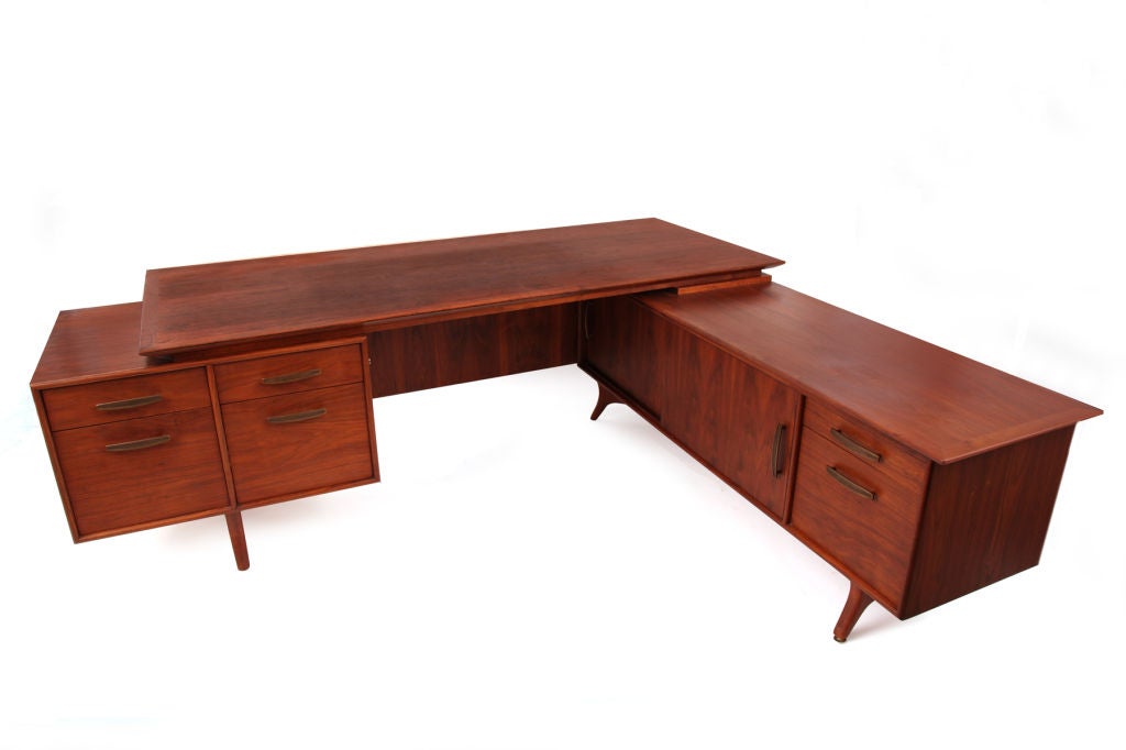 Walnut & Bronze Executive Desk & Return<br />
<br />
Stunning walnut and brass executive desk and credenza circa early 1960's. This example has 6 drawers in total and the credenza has 2 sliding doors with more than ample interior storage. The