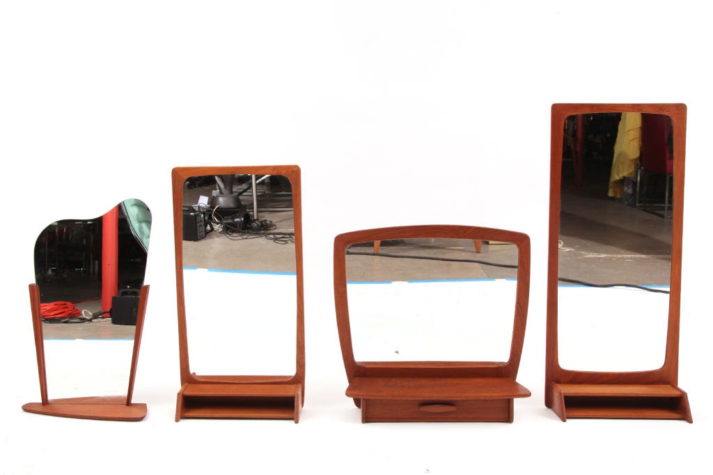 Group of 15 teak mirrors from Denmark.  Three of these examples have a drawer the others are a smattering of different shapes and sizes. <br />
Please inquire for individual dimensions. Price is for the set of 15.