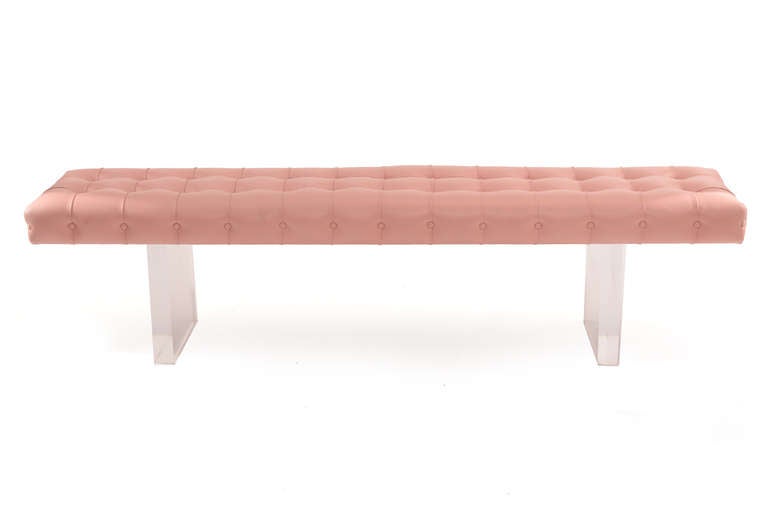 Glamorous pair of tufted leather and lucite benches circa early 1970's. These stunning examples have 1.5