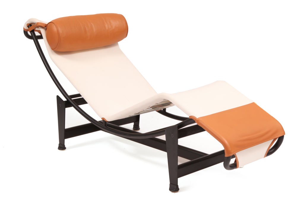 Pair of Le Corbusier LC4 chaise longues circa mid 1980's. These all original examples are upholstered in canvas with down filled butterscotch leather back cushions and accents. Price is for the pair.