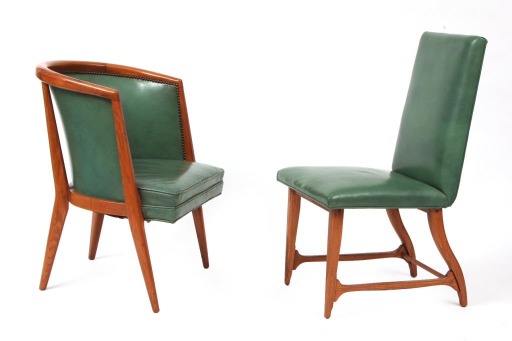 Six leather and solid oak dining chairs by Harold Schwartz for Romweber, circa early 1950s. The set is composed of two larger head chairs and four side chairs. The upholstery is the lovely original sage green leather with bronze tacks and wonderful
