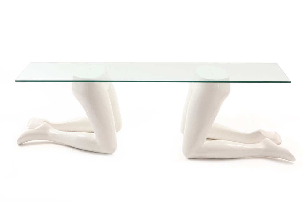 Wonderful post modern Italian cocktail table circa early 1970's. This example has two cast fiberglass kneeling female figures neath a 5 foot rectangular piece of glass. This will support a larger and wider piece of glass if needed.