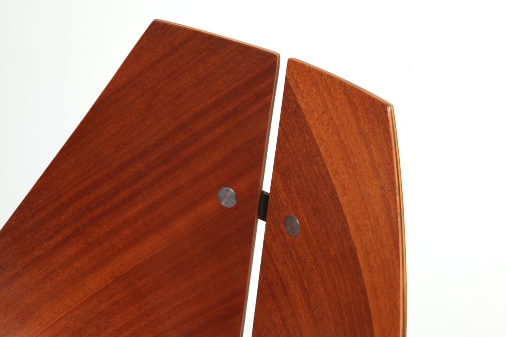Sculptural Ray Komai Occasional chair circa early 1950's. This iconic example has a bentwood walnut frame inlaid satin finished steel on the back with the same sarin finished steel legs.