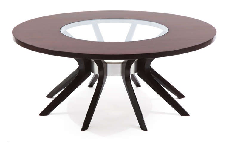 Sculpted walnut stainless steel and ceramic cocktail table, circa mid-1960s. This fine example has a walnut top with inset glass and free-form solid walnut legs. The walnut legs mount to a stainless steel ring that houses the original ceramic plant