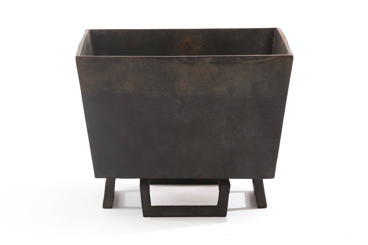 Pair of solid iron planters, circa 1920s. These all original examples have fabulous inset solid iron legs solid iron boxes and great patina. Price listed is for the pair.