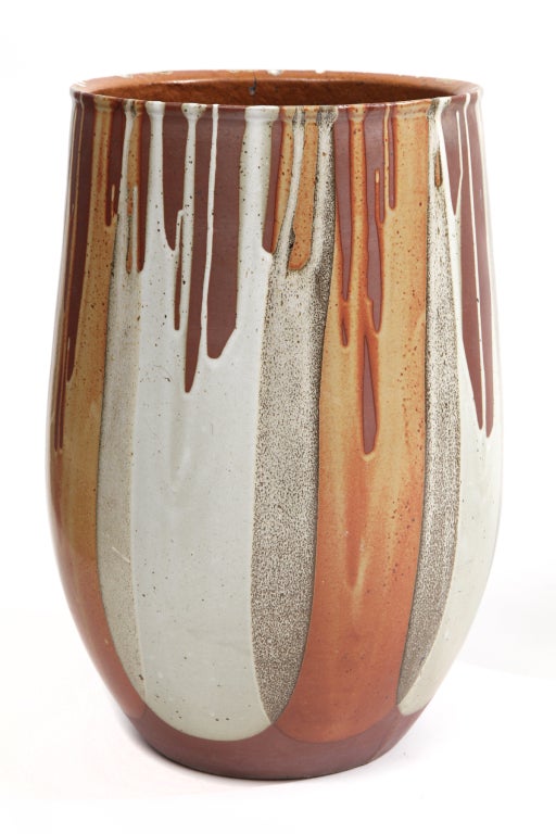Large scale stoneware vessel/planter by David Cressey circa 1960's. This example has Cressey's signature drip glaze and measures 23