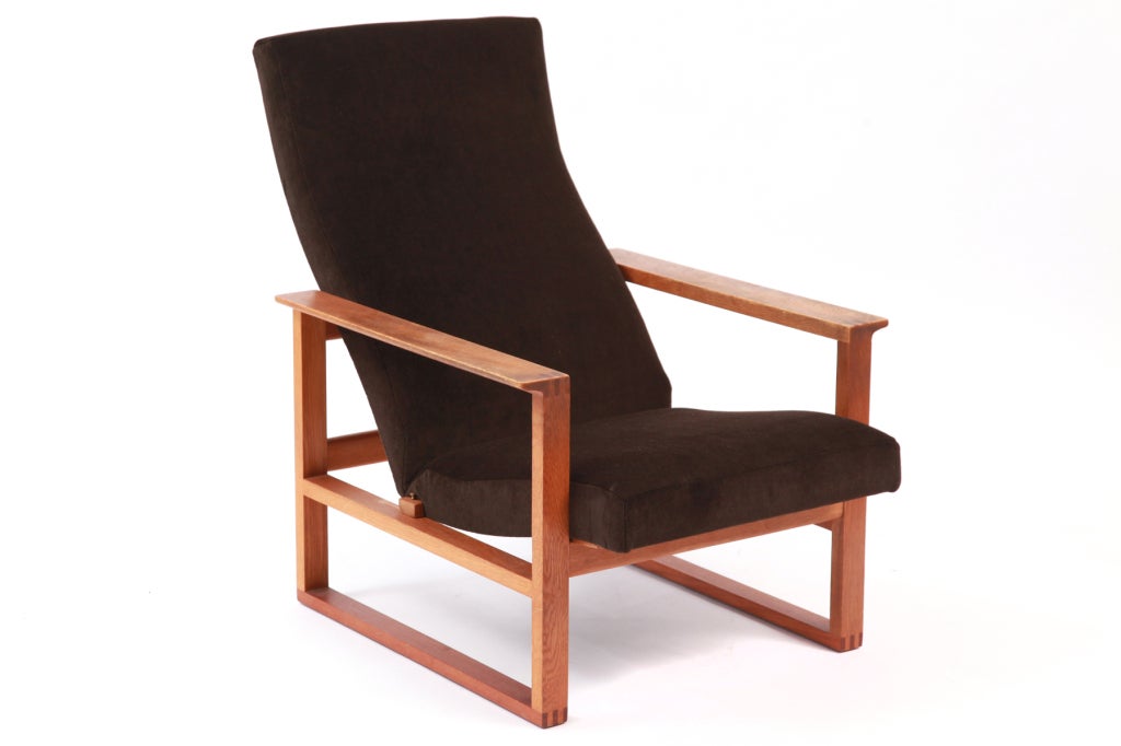High back adjustable lounge chair by Børge Mogensen, circa late 1950s. This example has tongue and groove joints and retains its original beautifully broken in finish to the solid oak frame. The upholstery has recently been done in a chocolate brown