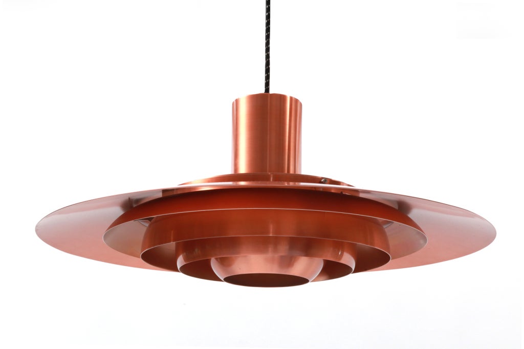 Fabricius & Kastholm for Nordisk Solar P-376 hanging lamp circa late 1960's. Originally designed in 1963.  This copper example has 6 copper rings and has been newly wired. Excellent original condition.