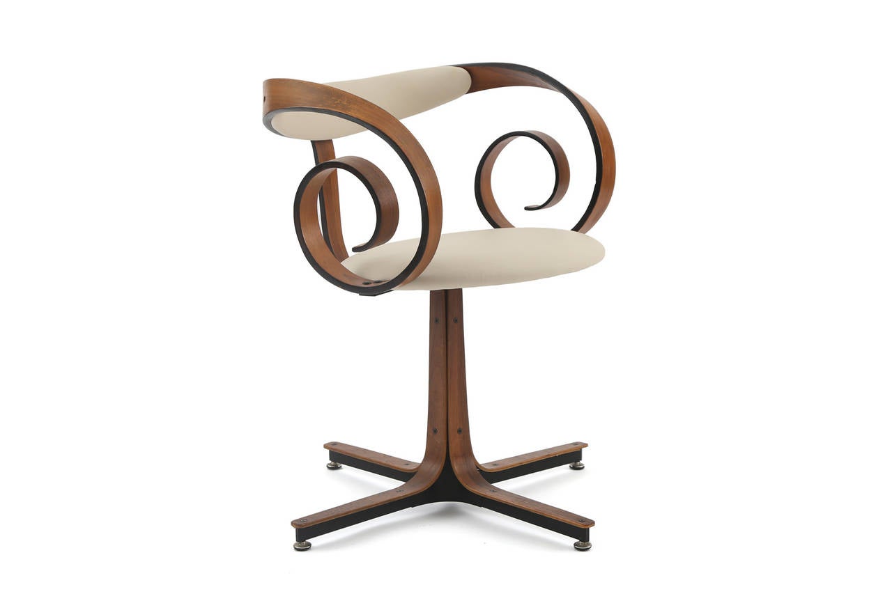 4 rare scroll chairs by George Mulhauser for Plycraft circa early 1960's. These phenomenal examples have bentwood walnut frames with ebonized accents. The chairs swivel as well. The upholstery has been newly done in a supple cream leather. Price