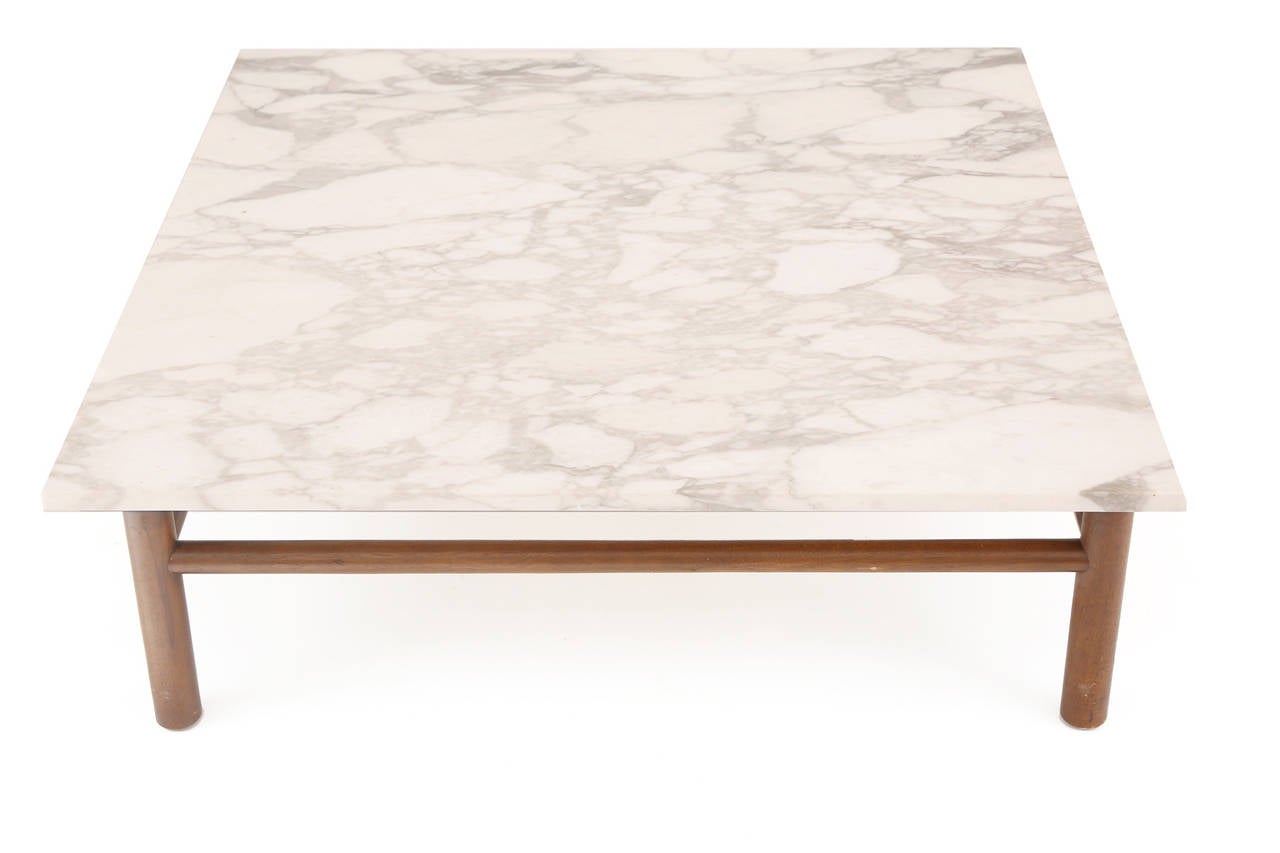 T. H. Robsjohn Gibbings for Widdicomb Calacatta marble and walnut cocktail table, circa late 1950s. This all original example has a stunning marble top with beautiful veining and color variation and solid tapered walnut base.