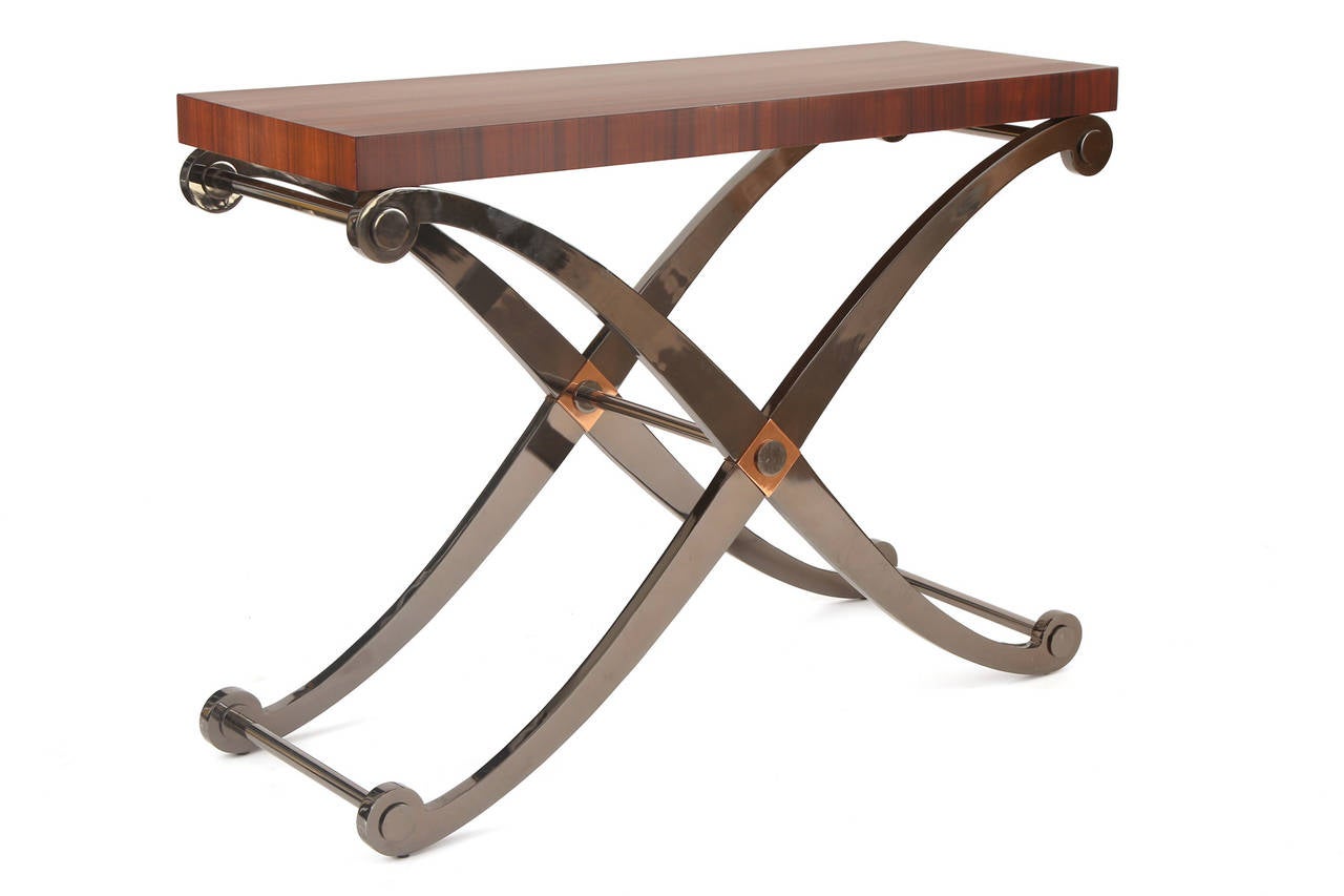 Fabulous steel copper and walnut console or sofa table from Italy, circa late 1970s. This example has a beautifully grained newly finished walnut top and solid steel X-base and stretchers with inset copper accents.