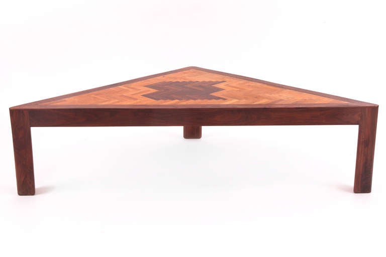 One off cocktail table by Raymond Connor circa mid 1960's. Connor was a craftsman who worked in Arizona and California from the 1950's - 1970's. This unusual example has a solid walnut triangular frame with parquayed oak and walnut top. it was