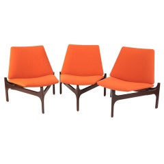 Three Sculpted Walnut and Upholstered Lounge Chairs