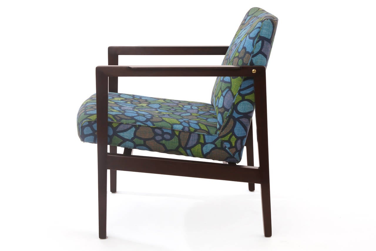 Rare Edward Wormley for Dunbar mahogany brass and upholstered armchair, circa late 1950s. The beauty of this chair is the original Jack Lenor Larsen floral fabric design in blues, greens and brown. The mahogany frame has been newly impeccably