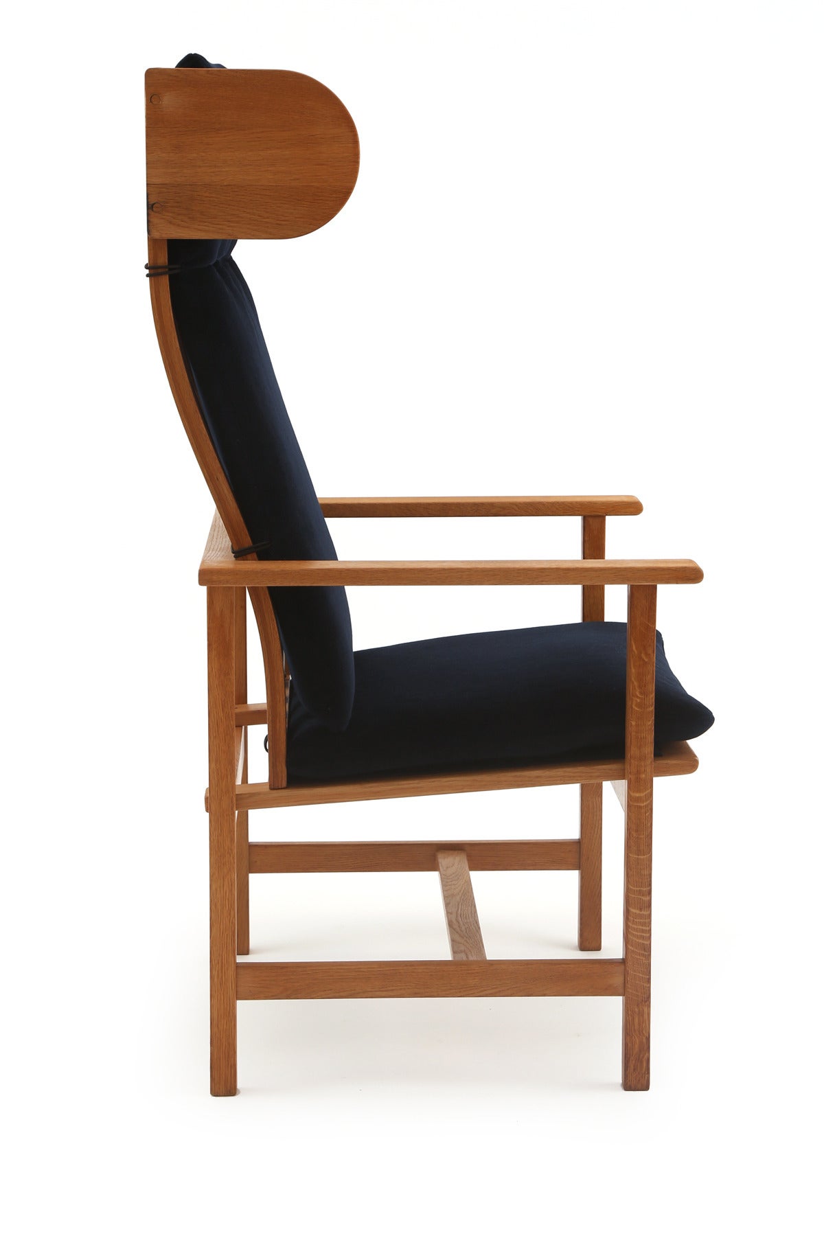 Pair of sculptural oak and mohair lounge chairs by Børge Mogensen, circa early 1960s. These unusual examples have beautifully grained solid oak frames 
and have been newly upholstered in a plush navy blue mohair. Price listed is for the pair.