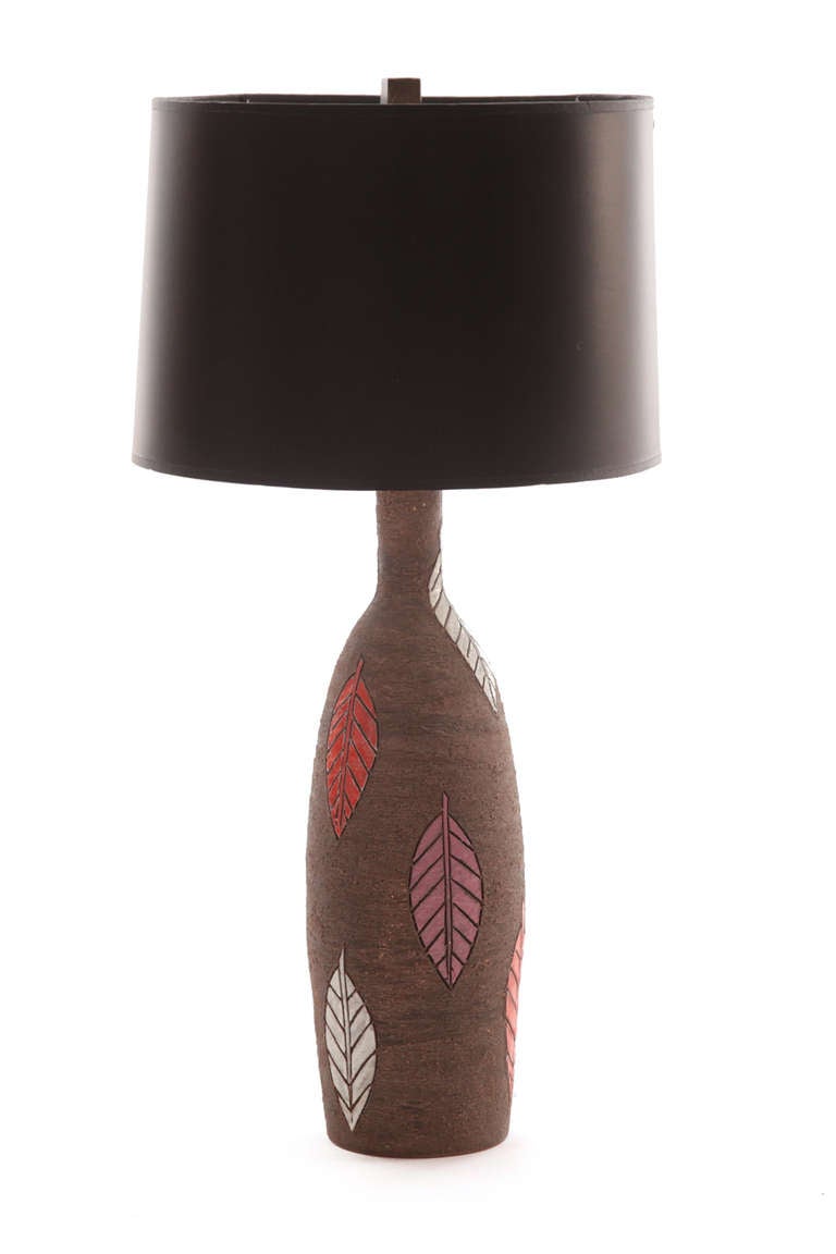 Ceramic leaf lamp by Raymor circa late 1950's. This example has hand carved and multi colored glazed leaves. Height to socket is 22.5