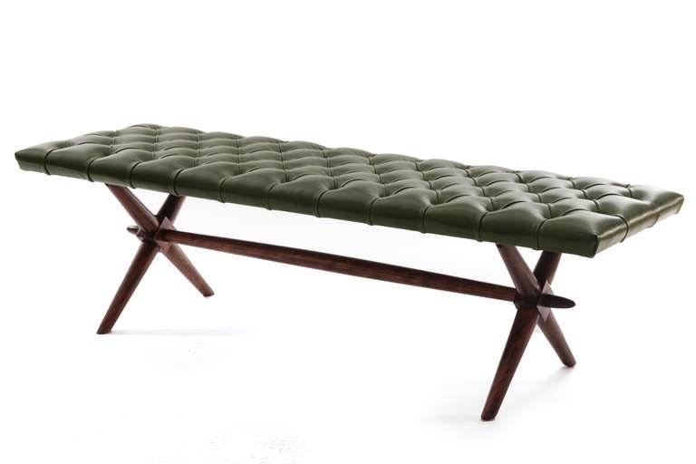 Stunning leather bench by T.H. Robsjohn Gibbings for Widdicomb circa late 1950's. This sculptural example has been newly upholstered in a lovely and supple hunter green leather that sits atop the solid stained maple base.