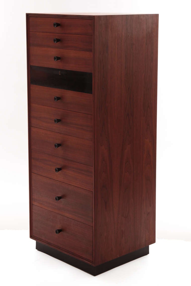 Rare 10 drawer chest of drawers by Kipp Stewart and stewart Macdougall for Glenn of California circa mid 1960's. This example has a walnut box and drawer fronts, black bronze metal drawer pulls and original ebonized single drawer front.