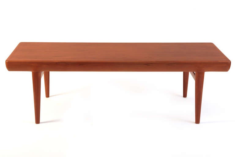 Johannes Andersen teak cocktail table with drawers circa late 1950s. This unusual example has been impeccably finished and has a drawer that comes out either side for more than ample storage.

  