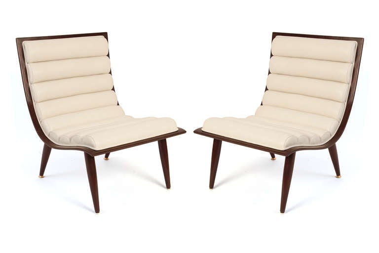 Elegant bentwood and rolled leather lounge chairs circa late 1950's. These examples have newly finished backs and legs and have been upholstered in a lovely cream leather. Price listed is for the pair.
