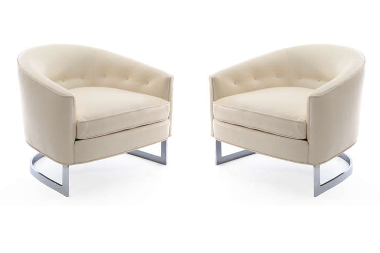 Pair of leather and steel tub chairs by Milo Baughman for Thayer Coggin, circa late 1960s. These lovely examples have subtly curved chrome-plated steel bases and have been newly upholstered in a supple cream leather. Price listed is for the pair.
