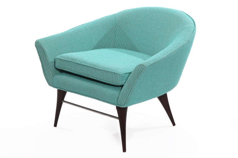 Sculptural tub chair by Karpen, circa late 1950s. This lovely example has conical walnut legs with anodized metal stretcher and has been newly upholstered in a lovely powder blue heathered tweed.