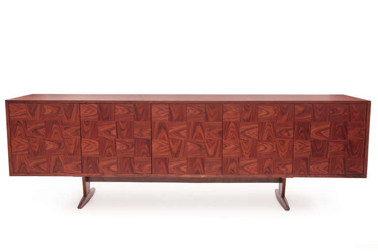 Rare Giuseppe Scapinelli patchwork rosewood sideboard, circa late 1950s. This stunning nearly 8′ example has four doors clad patchwork rosewood fronts and beautifully grained rosewood case. The center section has four drawers and behind the other