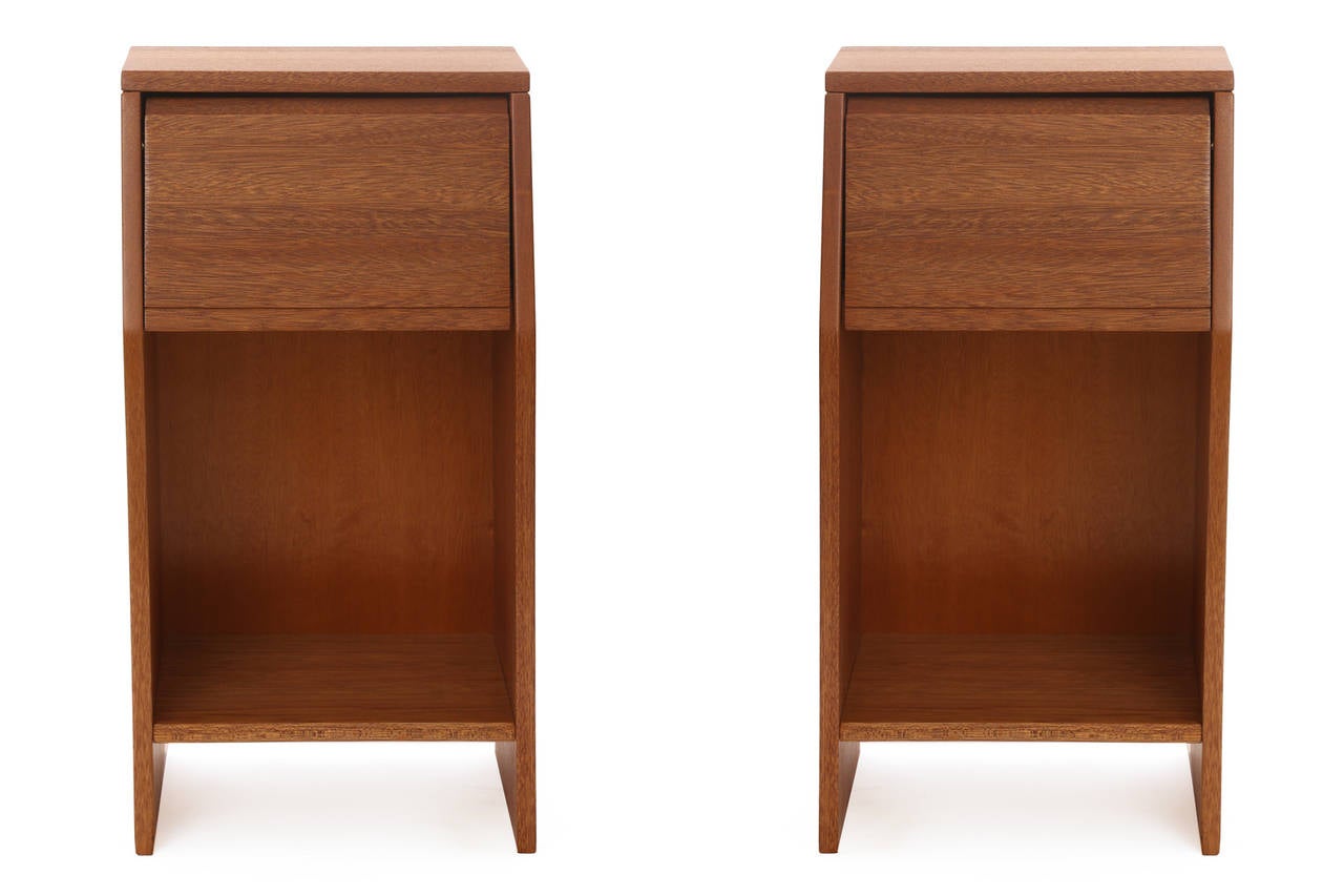 Pair of striped African nightstands by Brown Saltman, circa late 1950s. These elegant examples have tapered sides and hinged doors with lots of interior space for storage. They have recently been impeccably refinished. Price listed is for the pair.