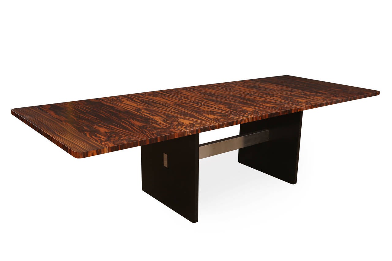 Macassar ebony and chrome dining table by Berkey. This example has phenomenal graining and comes with two leaves. Fully extended the table measures 110