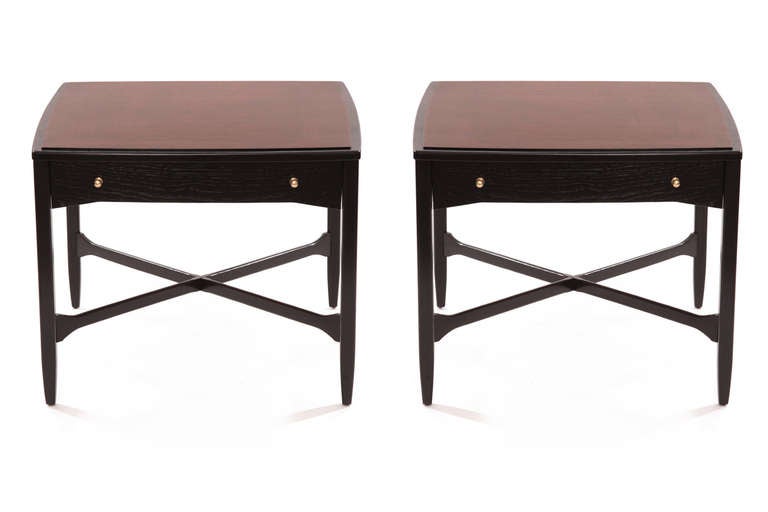 Pair of ebonized and book matched mahogany night stands circa mid 1960's. these examples have black lacquered legs, stretchers and drawer fronts. The drawer pulls are satin finished brass. The tops of these night stands are beautifully book matched