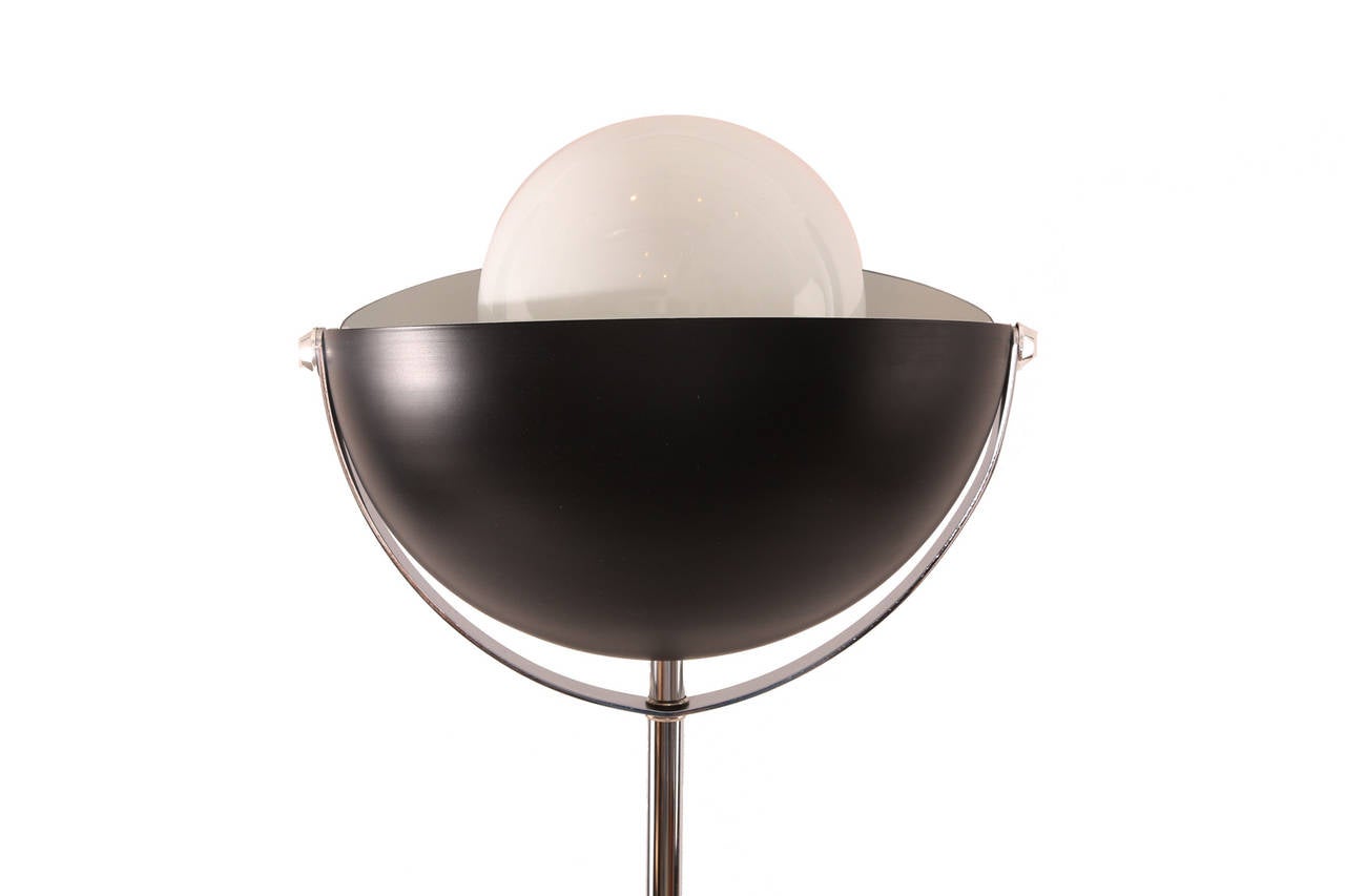 Rare eclipse floor lamp by RAAK, circa early 1970s. This seldom seen example has a chrome base and stem with a retractable two-piece dome shade.