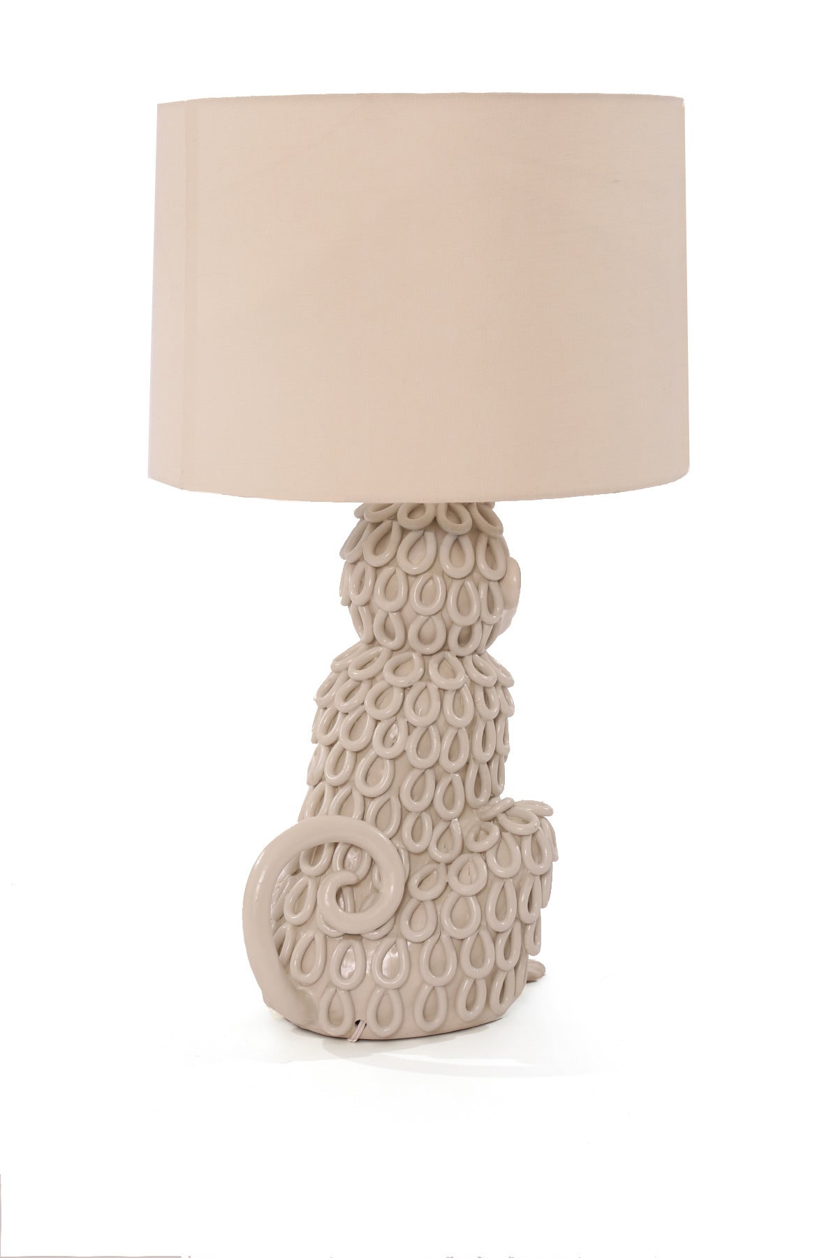 Large-scale Italian monkey lamp, circa late 1950s. This whimsical example is off-white porcelain and has been newly wired. Sold without the shade.
Measures: Shade shown is 12